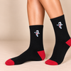 Black crew socks with red toe and heel and embroidered astronaut design
