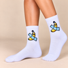 White crew socks with yellow banana wrapped in blue bandage design