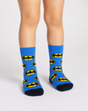 Blue Batman kids crew socks for children aged 3–4 years featuring an all-over Batman logo pattern with black heel and toe.