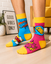 Colorful comic book themed mismatched socks featuring Bang, Pow and Wow pop art graphics in blue, pink and yellow.
