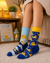 Blue and yellow crew socks featuring cute rubber duck patterns, soap bubbles, and bath-time cartoon artwork