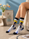 Grey and blue cartoon inspired crew socks featuring animated girl character artwork
