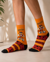 Colorful crew socks featuring Chester Cheetah inspired design on a fun novelty sock pattern.