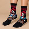 Black Chucky horror crew socks with red-haired doll graphic