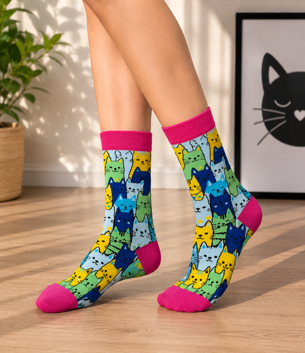 Colorful Cartoon Cat Socks with cute multicolored cat pattern on a pink background.