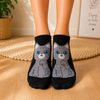 Black ankle socks featuring a cute grey cartoon cat with bright blue eyes and pink nose