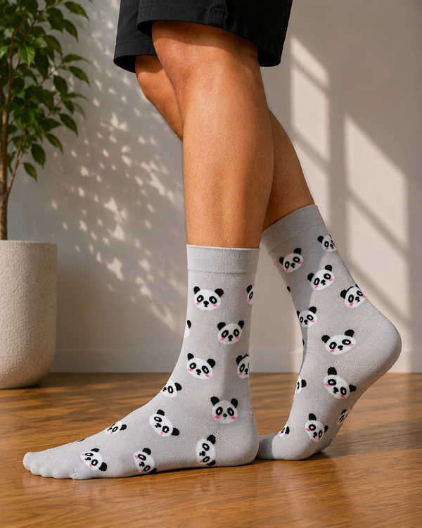 Light gray crew socks featuring an all-over pattern of cute panda faces with pink cheeks.