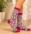 Cute Panda & Pink Umbrella Crew Socks with colorful all-over animal pattern on a white background.