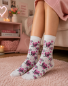 White crew socks featuring pink love hearts, winged heart designs, and romantic love text patterns