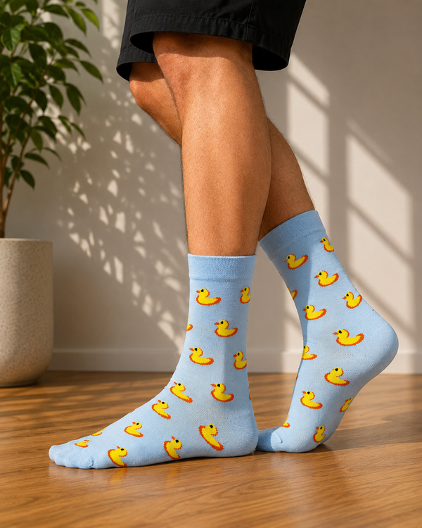 Light blue crew socks featuring an all-over pattern of yellow rubber ducks.