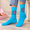 Blue crew socks featuring a pink sprinkled donut and Donut Worry design