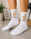 White crew socks featuring a funny duck-inspired graphic with humorous text for a playful novelty design.