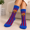 Blue crew socks with red vertical stripes featuring the FC Barcelona crest