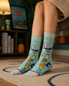 Mint green crew socks featuring a funny Squidward cartoon character design with blue polka dot background