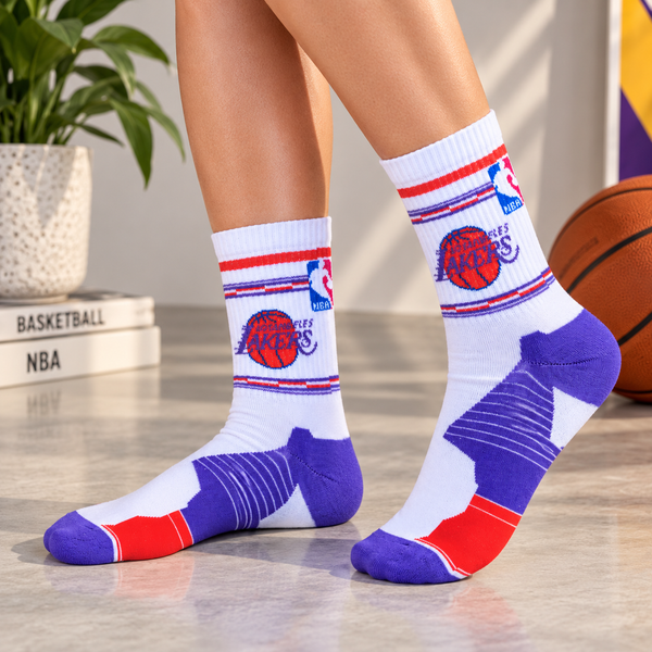 White crew socks featuring Los Angeles Lakers basketball graphics with purple and red details