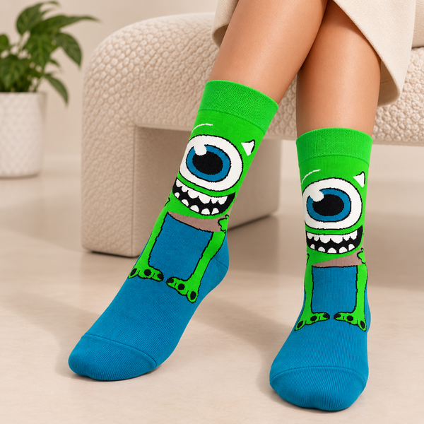 Green and blue crew socks featuring Mike Wazowski with his large single eye and smiling monster design