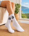 White crew socks with black Not Your Babe text embroidery design