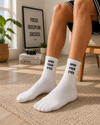 White crew socks with Open Your Eyes black text statement design