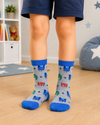 Grey and blue PJ Masks kids crew socks for children aged 5–6 years featuring Catboy, Gekko, and Owlette in an all-over pattern.