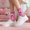 Pink crew socks with fluffy googly eye cartoon design for casual unisex wear