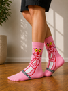 Pink Panther crew socks featuring a large Pink Panther character graphic on a pink background