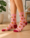 Pink crew socks with colorful tomato pattern and contrasting dark red heels and toes