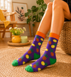 Purple socks with pineapple fruit patterns and colorful tropical design