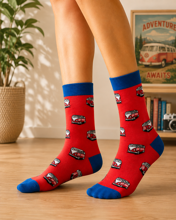 Red crew socks featuring repeating red and white retro camper vans with royal blue cuffs and toes