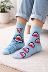 Light blue socks with shark graphics, shark mouth patterns, wave details, and Bite Me text