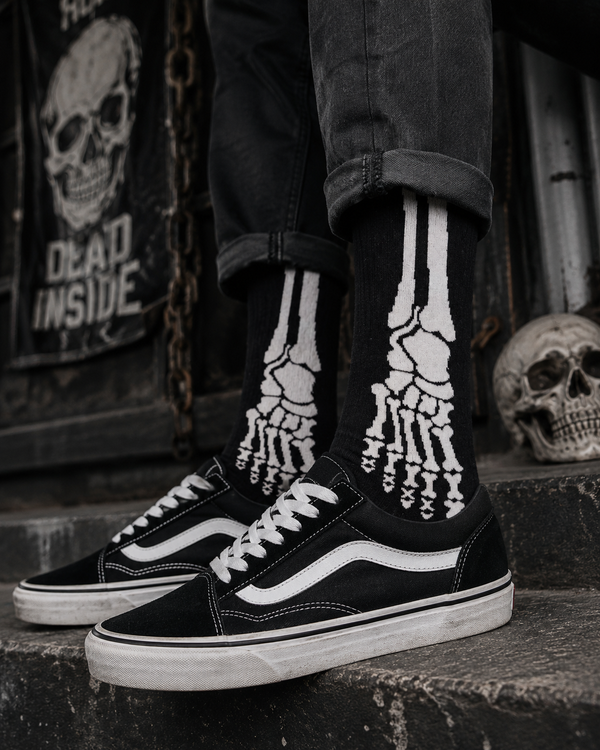 Black crew socks featuring a bold white skeleton foot bone graphic in an X-ray-inspired design.