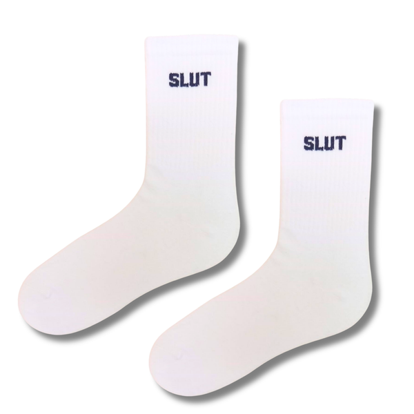 White crew socks featuring bold black SLUT text on the ankle