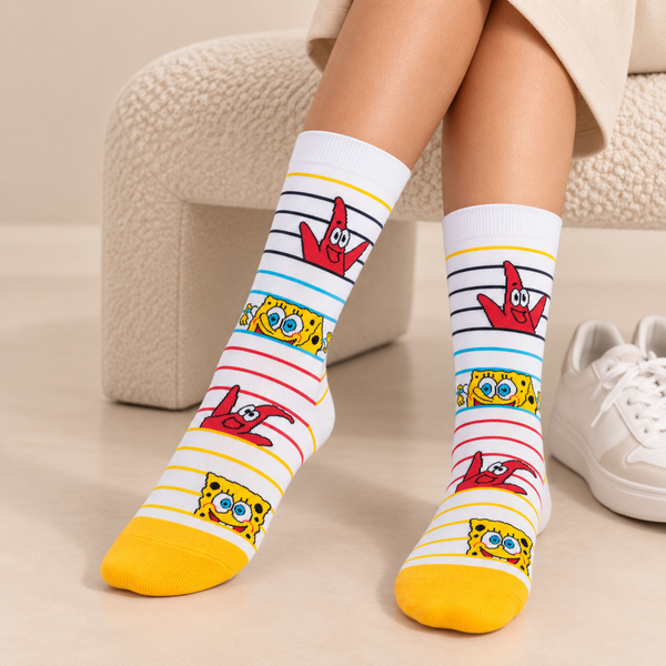 White striped crew socks featuring SpongeBob SquarePants and Patrick Star with colorful yellow, blue, red and black details