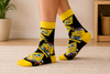Black and yellow SpongeBob pattern crew socks with cartoon face design