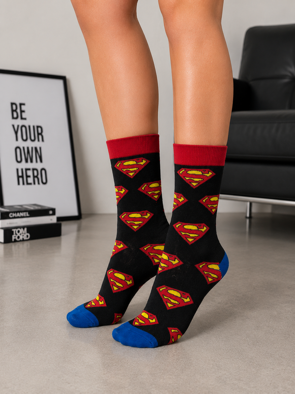 Black crew socks with repeating Superman logo pattern, red cuff, blue toe, breathable unisex cotton socks.