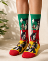 Colorful cartoon socks featuring angry Tom and Jerry scenes in green, red, and yellow panels.