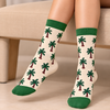 Tropical Palm Tree Socks featuring green palm trees with brown trunks on a cream background, green cuffs and toes, available at Socks Store Bahrain. Copy