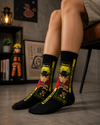 Black anime crew socks featuring Naruto character artwork with yellow and red manga-inspired graphics