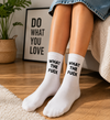 White crew socks with bold What The Fuck text design