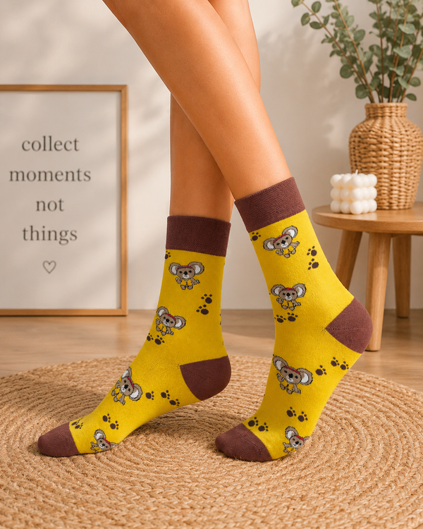 Yellow koala pattern socks with brown accents displayed in a fun casual style
