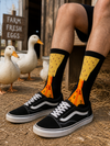 Black crew socks with orange duck feet illusion design, unisex cotton socks