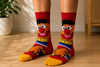 Front view of Ernie inspired cartoon crew socks with colorful retro character design on a clean background.