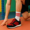 White activewear socks featuring Gym King logo worn with sneakers