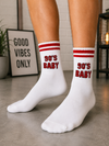 White crew socks with red athletic stripes and a bold 90's Baby graphic in retro lettering.