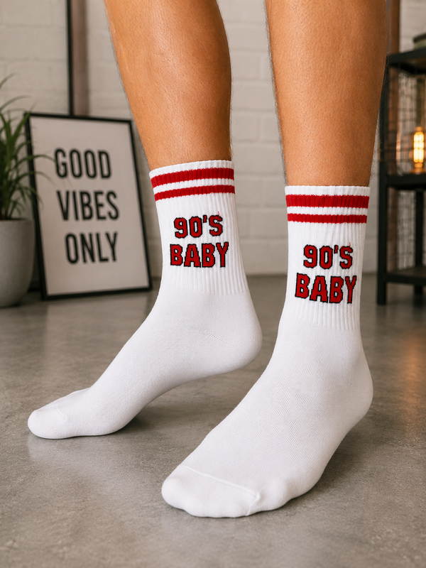 White crew socks with red athletic stripes and a bold 90's Baby graphic in retro lettering.