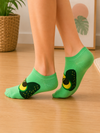 Green ankle socks with a large avocado pattern on the side.
