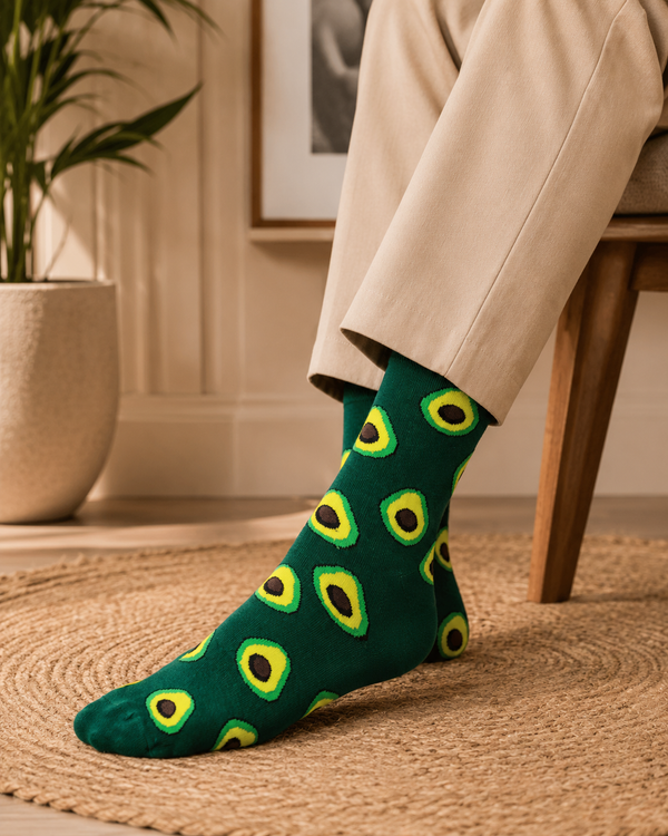 Green crew socks with an all-over avocado pattern featuring bright green and yellow avocado halves.