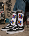 White crew socks featuring colorful “BAD VIBES ONLY” text graphics in a bold comic-inspired streetwear design.