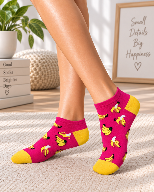 Pink and yellow ankle socks featuring a playful banana pattern.
