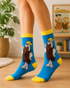 Blue crew socks featuring Barney Rubble from The Flintstones with yellow cuffs and toes