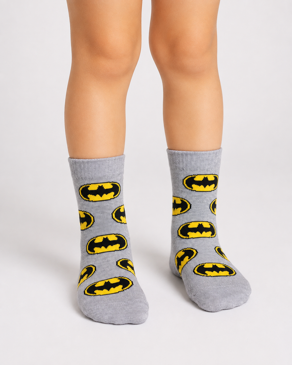 Grey Batman kids crew socks for children aged 3–4 years featuring an all-over Batman logo pattern.